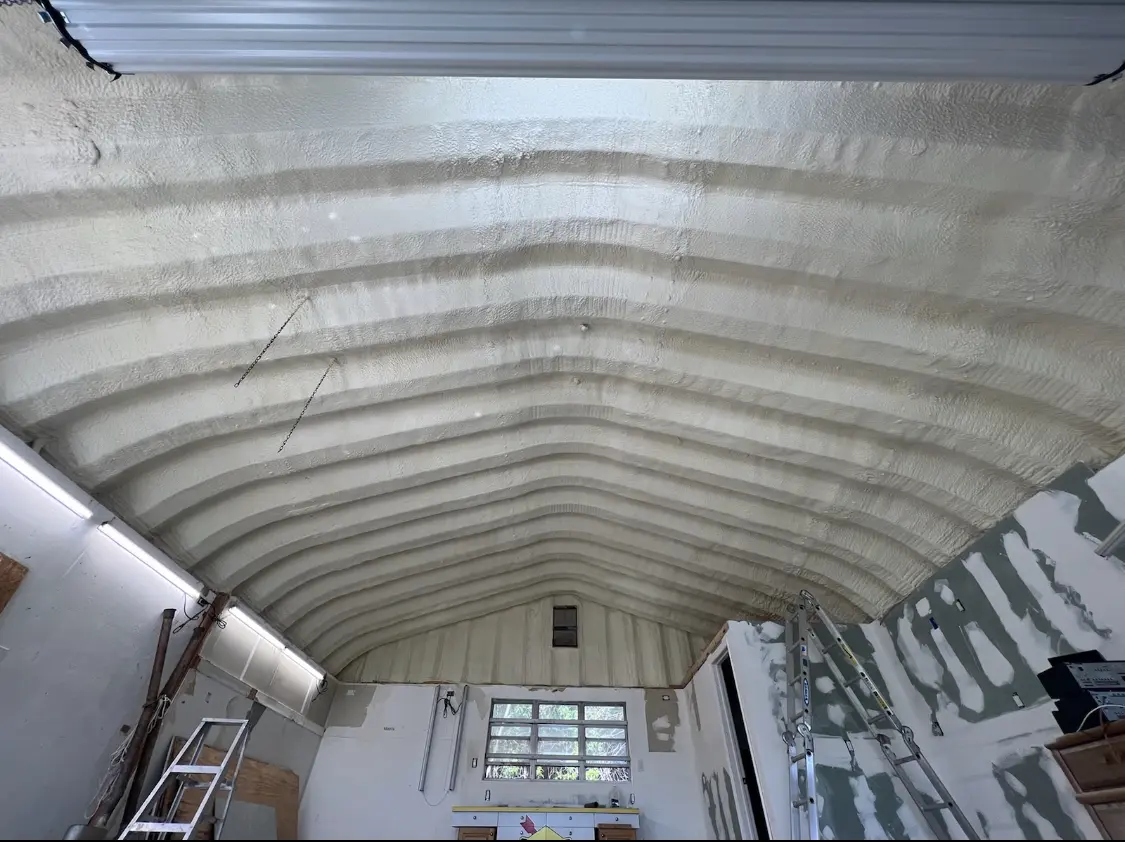 Spray polyurethane foam applied to the underside of a metal roof deck in Georgetown